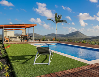Amazing swimming pool and outdoor seating area with 270 degree views of the surrounding mountains.
